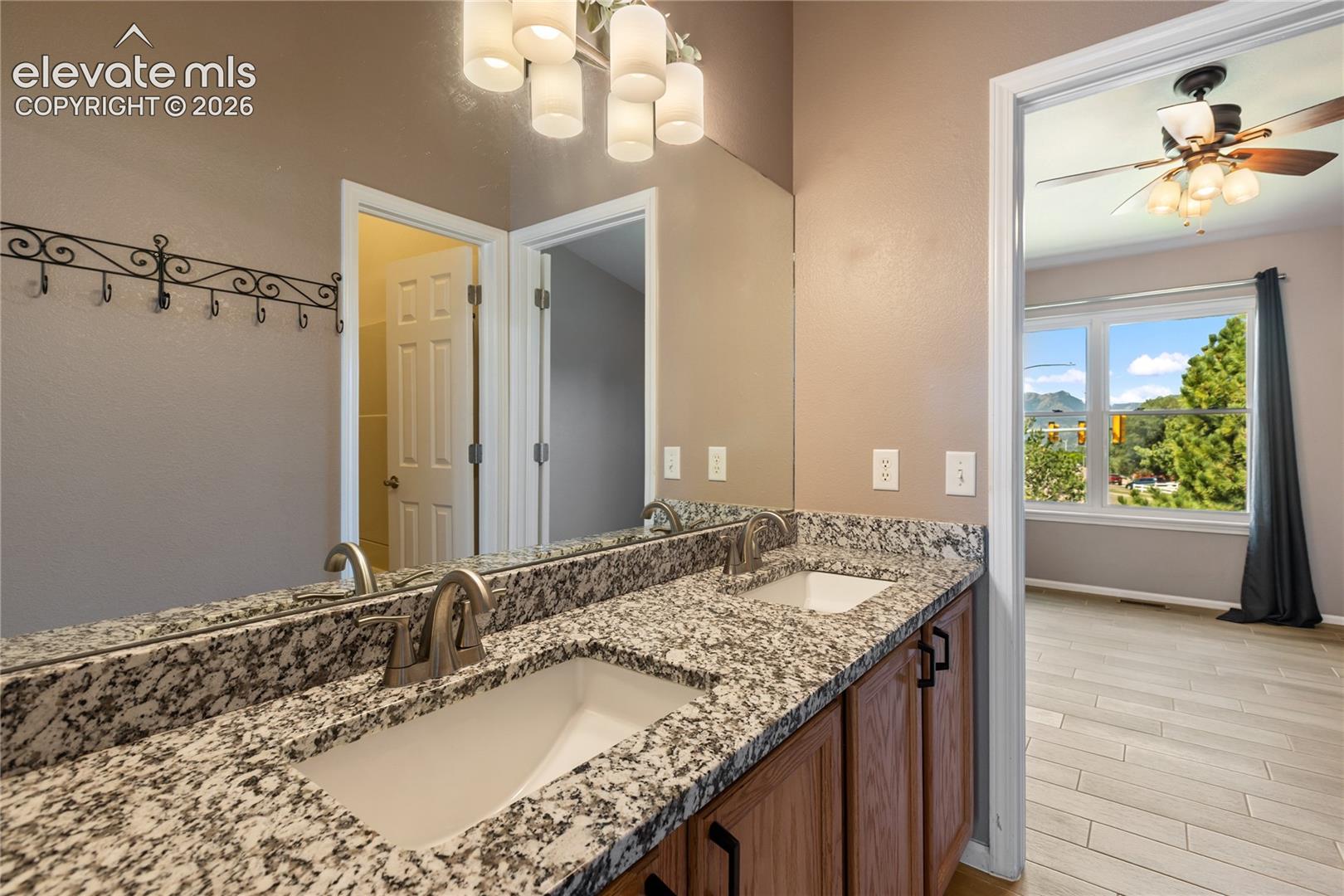 Double vanity, natural light, new granite countertop upstairs bathroom.