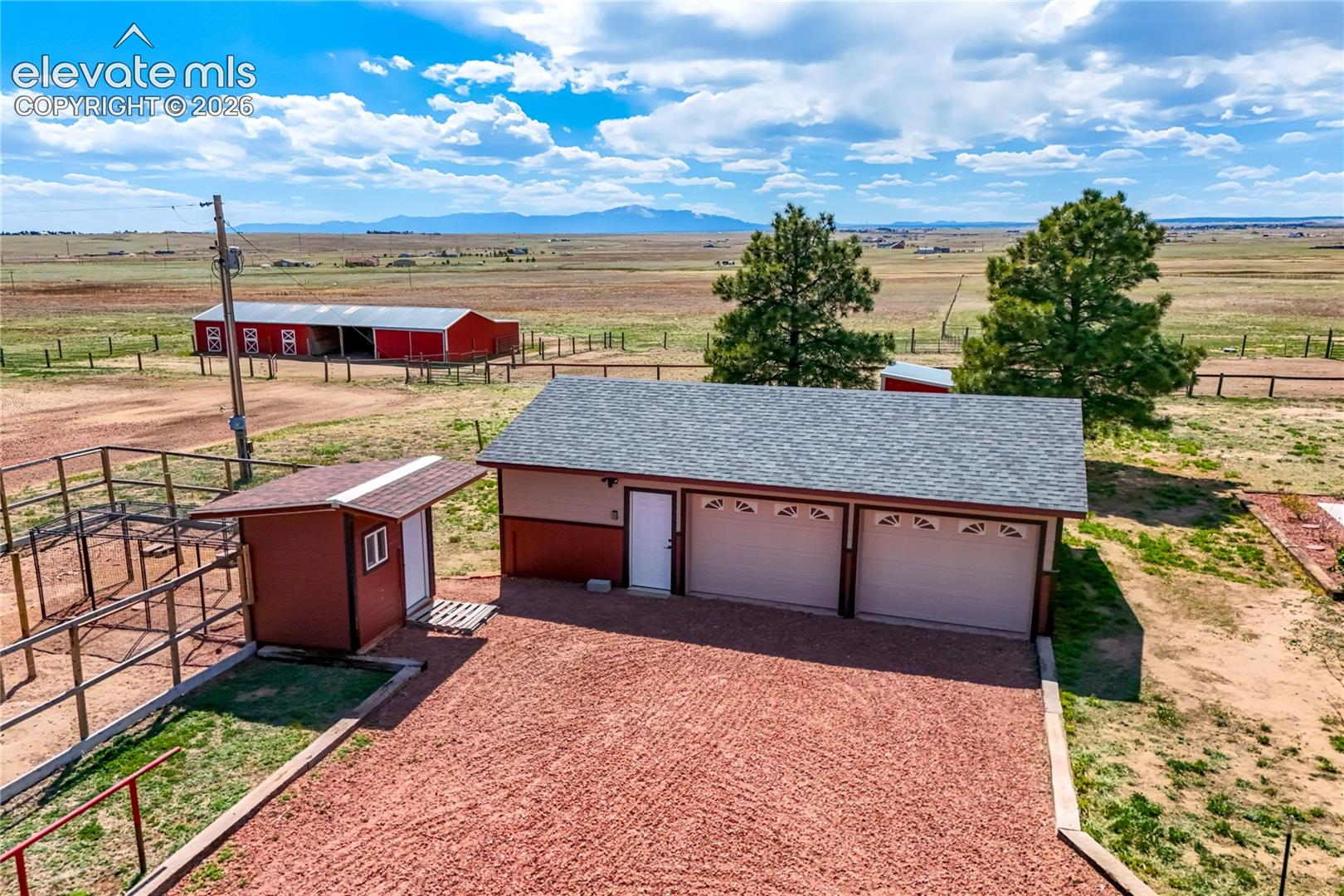 2 car garage with shop area, chicken coop to left
