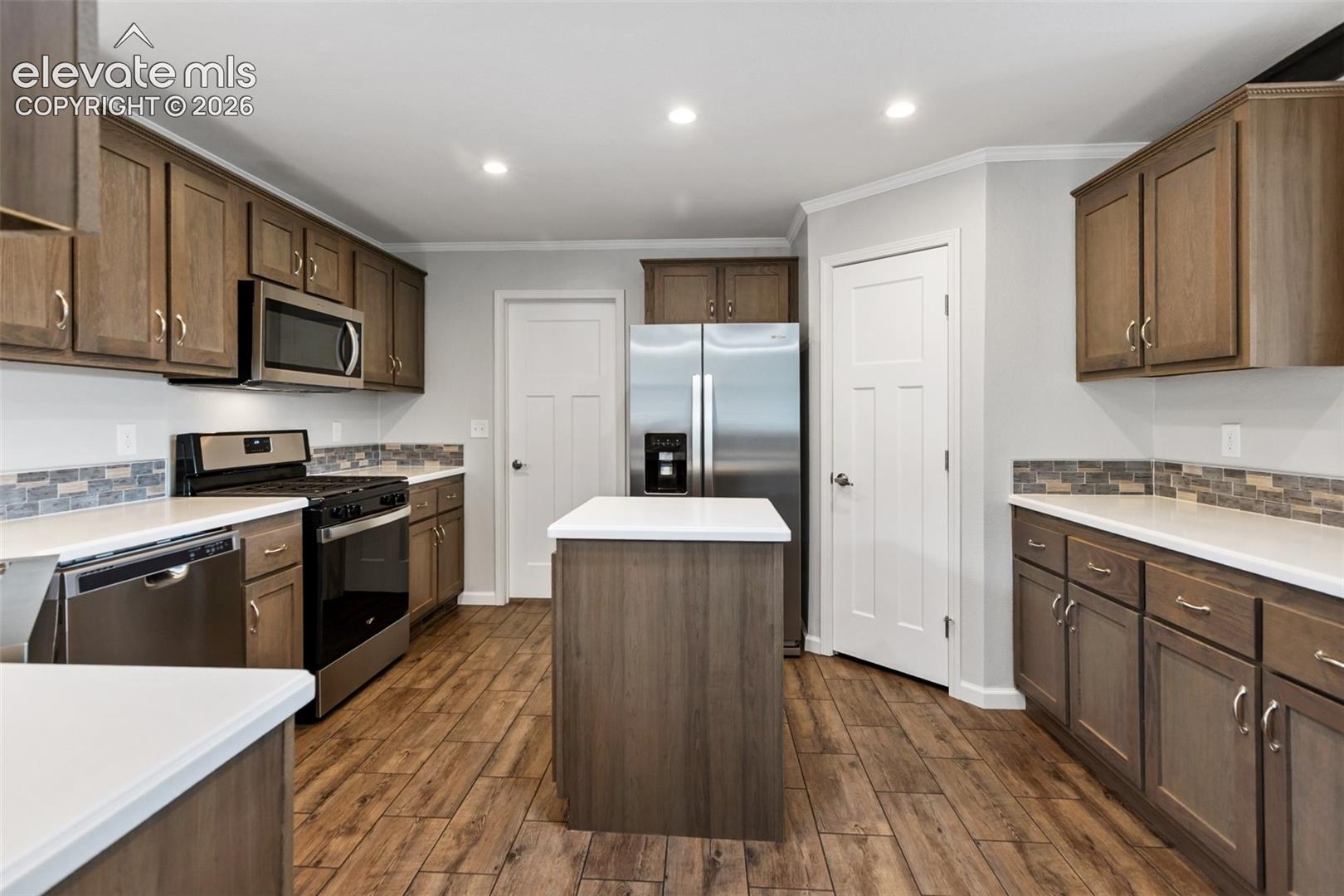 Kitchen with island and pantry.