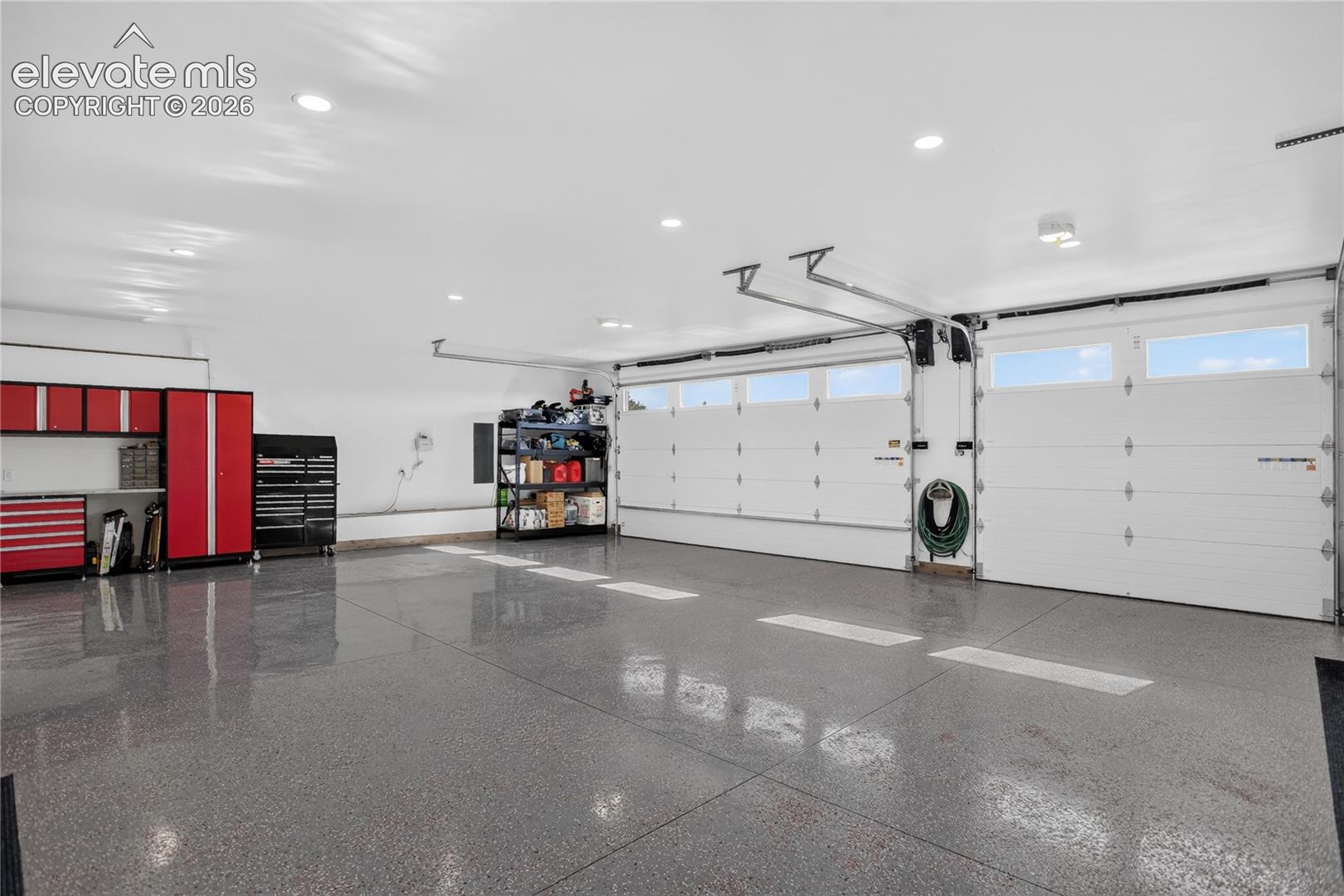 Sloped epoxy flooring & oversized, insulated garage doors