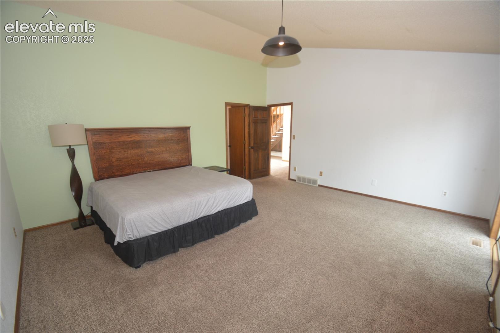 view from inside room toward room entry door.
