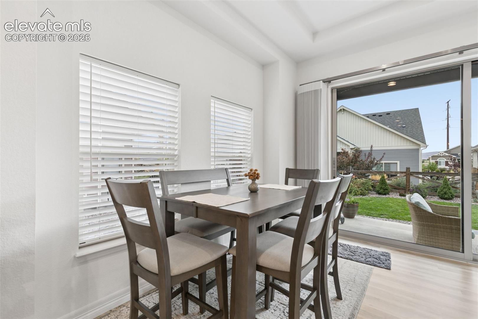 Dining area overlooking patio through Colroado Doors 