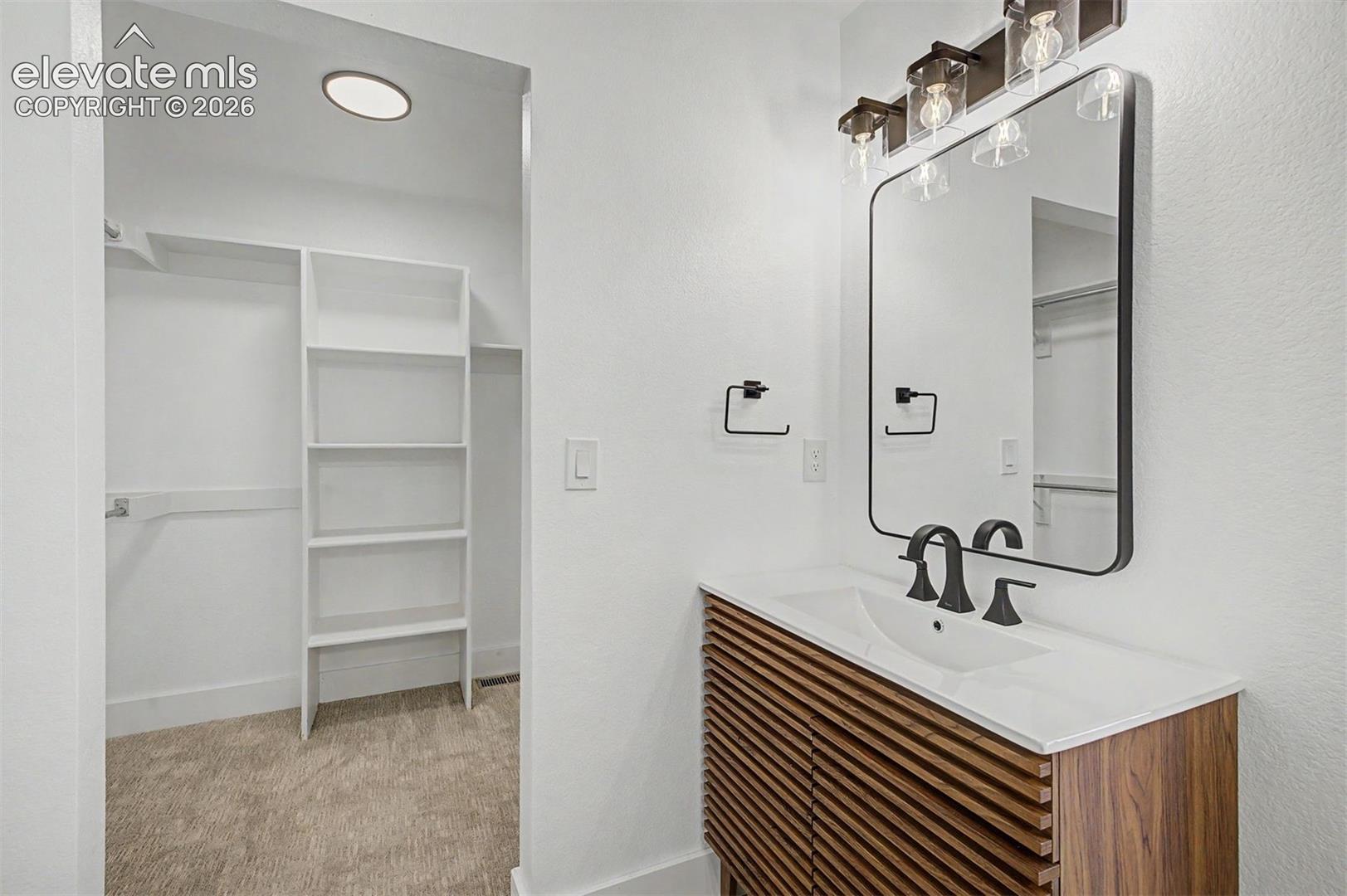 Primary 4 piece bathroom, beautifully updated. Walk in closet attached