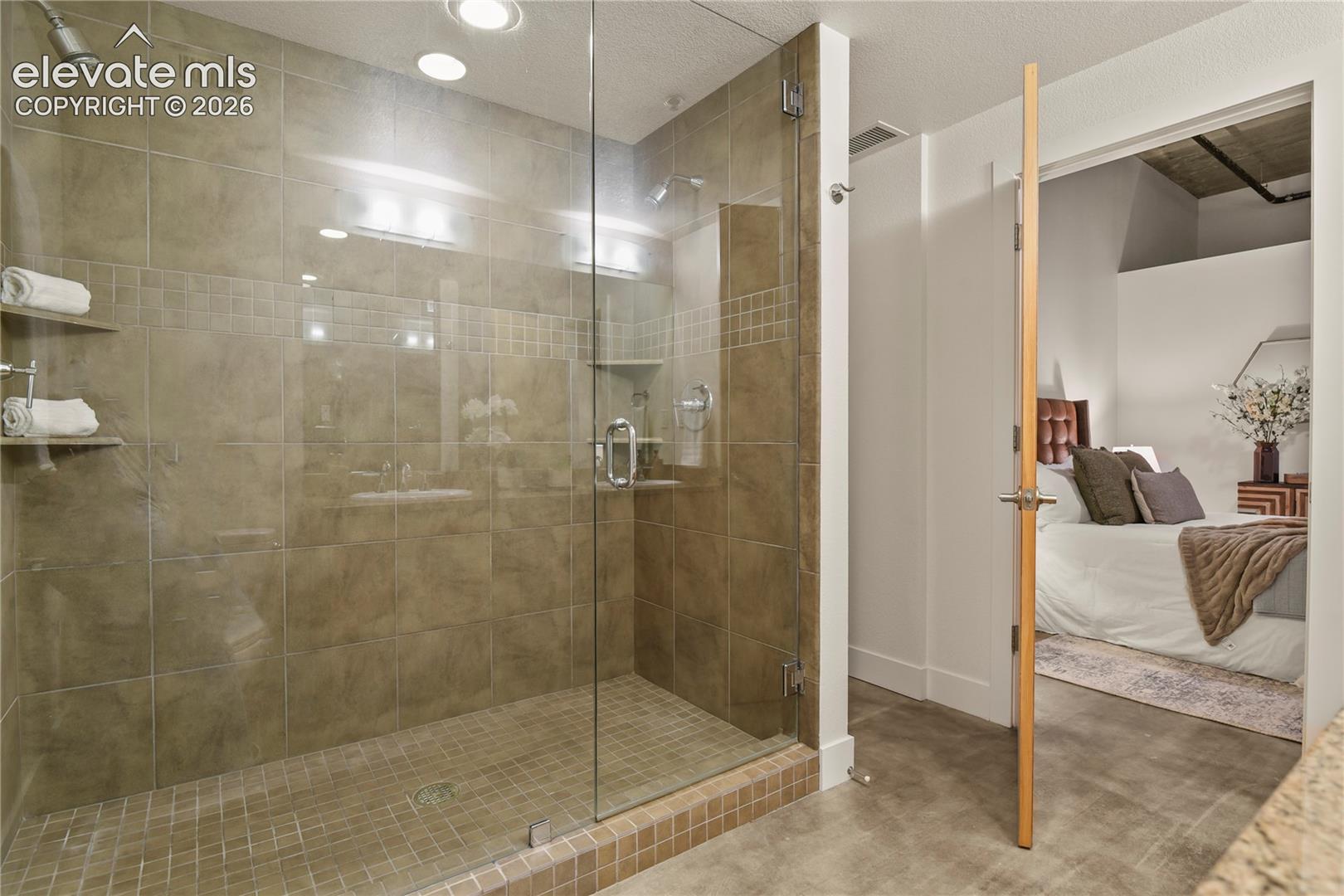6' shower with dual shower heads and frameless glass