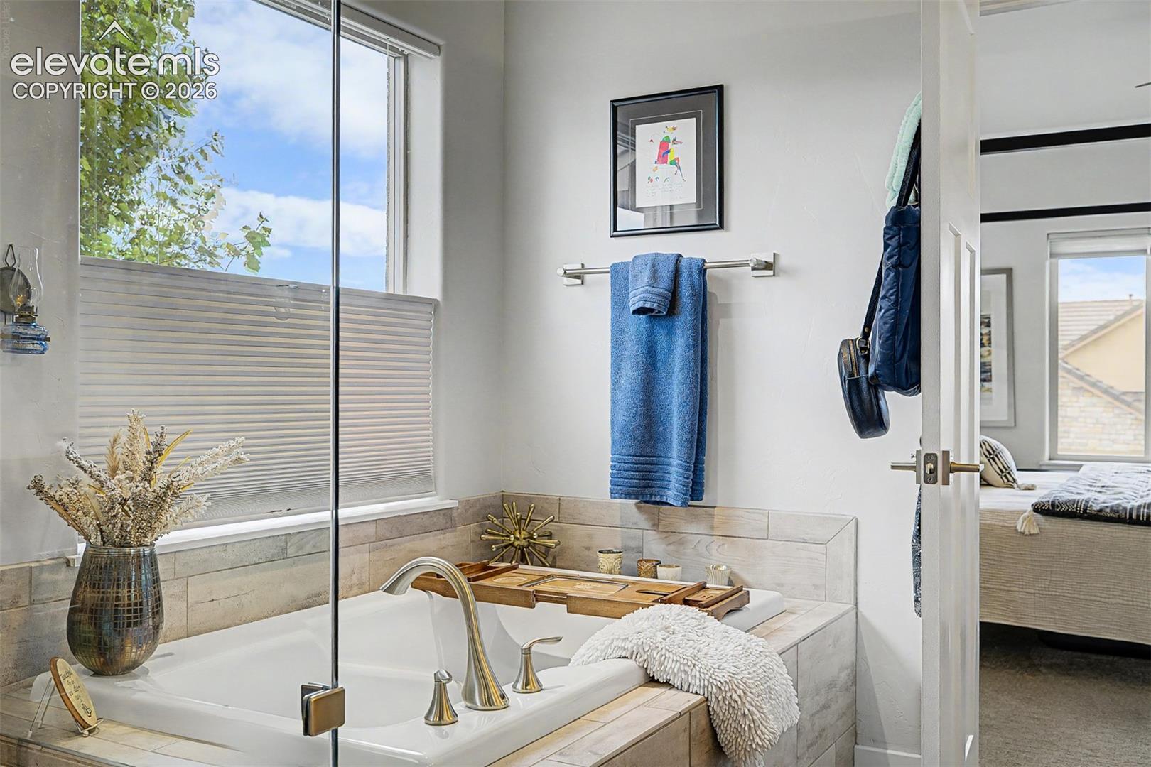 Top-down custom shades for privacy and plenty of natural light to set the mood for a long, relaxing bath!