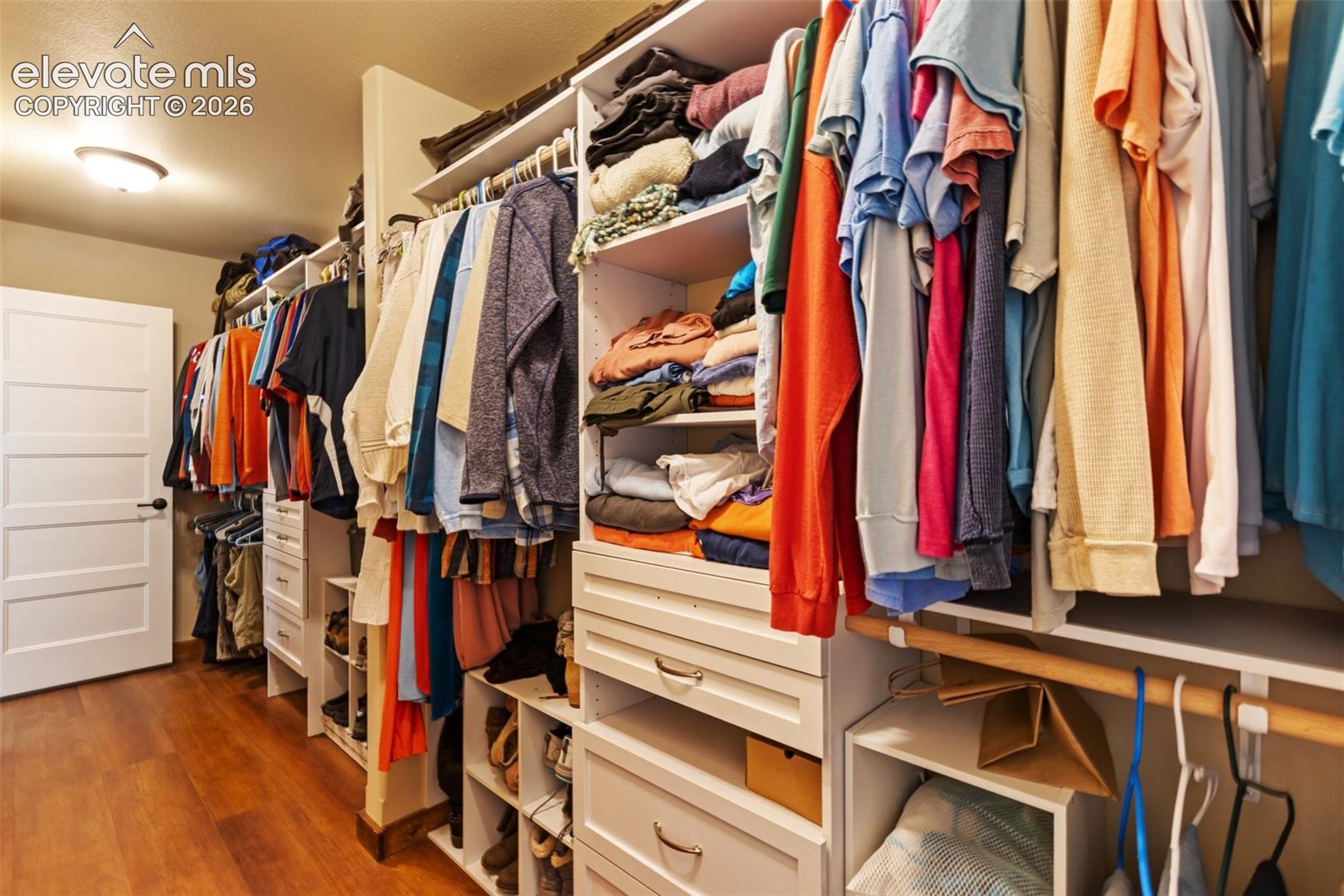 Primary bedroom walk-in closet 