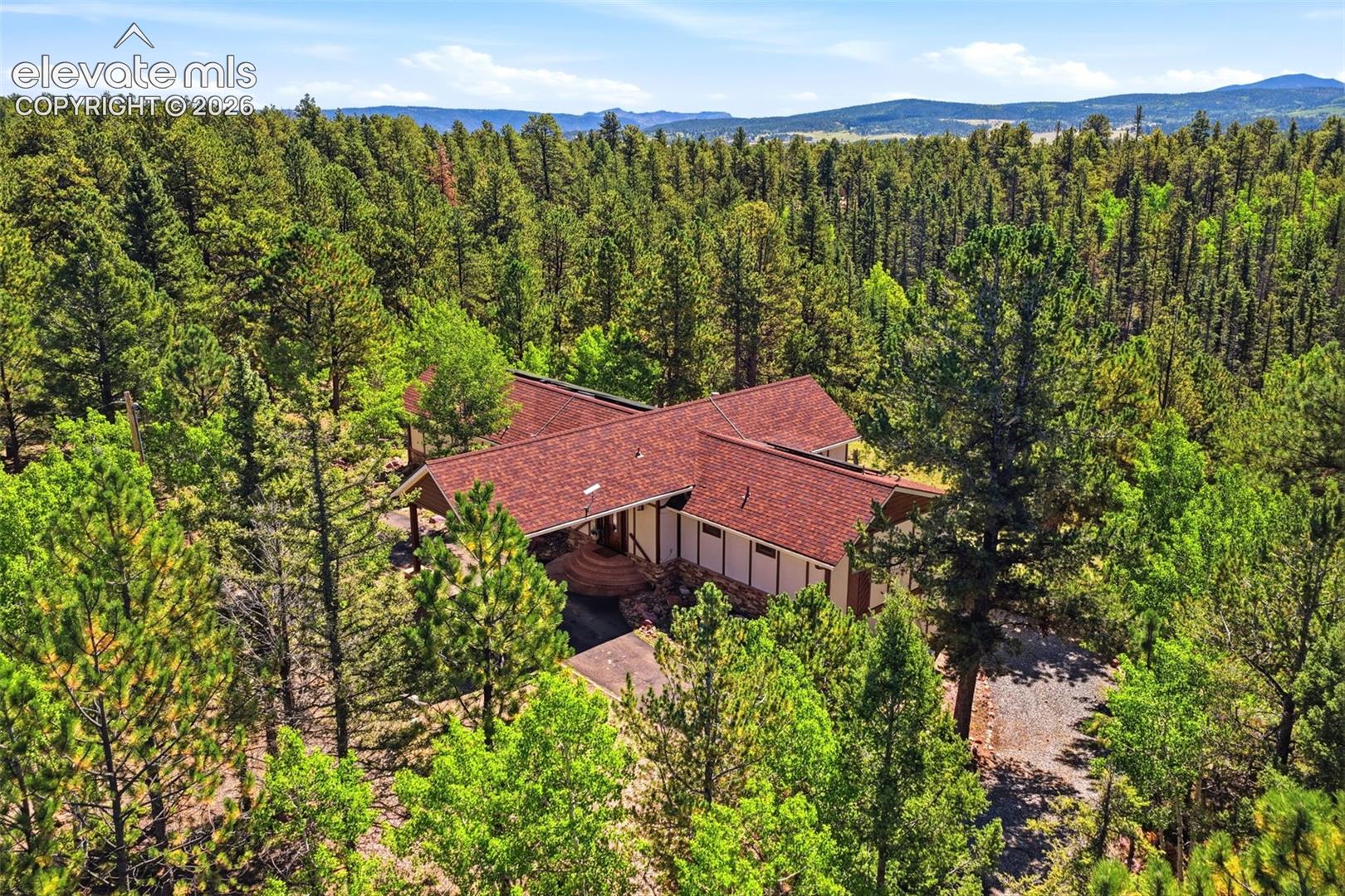 Extensive forested surroundings with mature trees