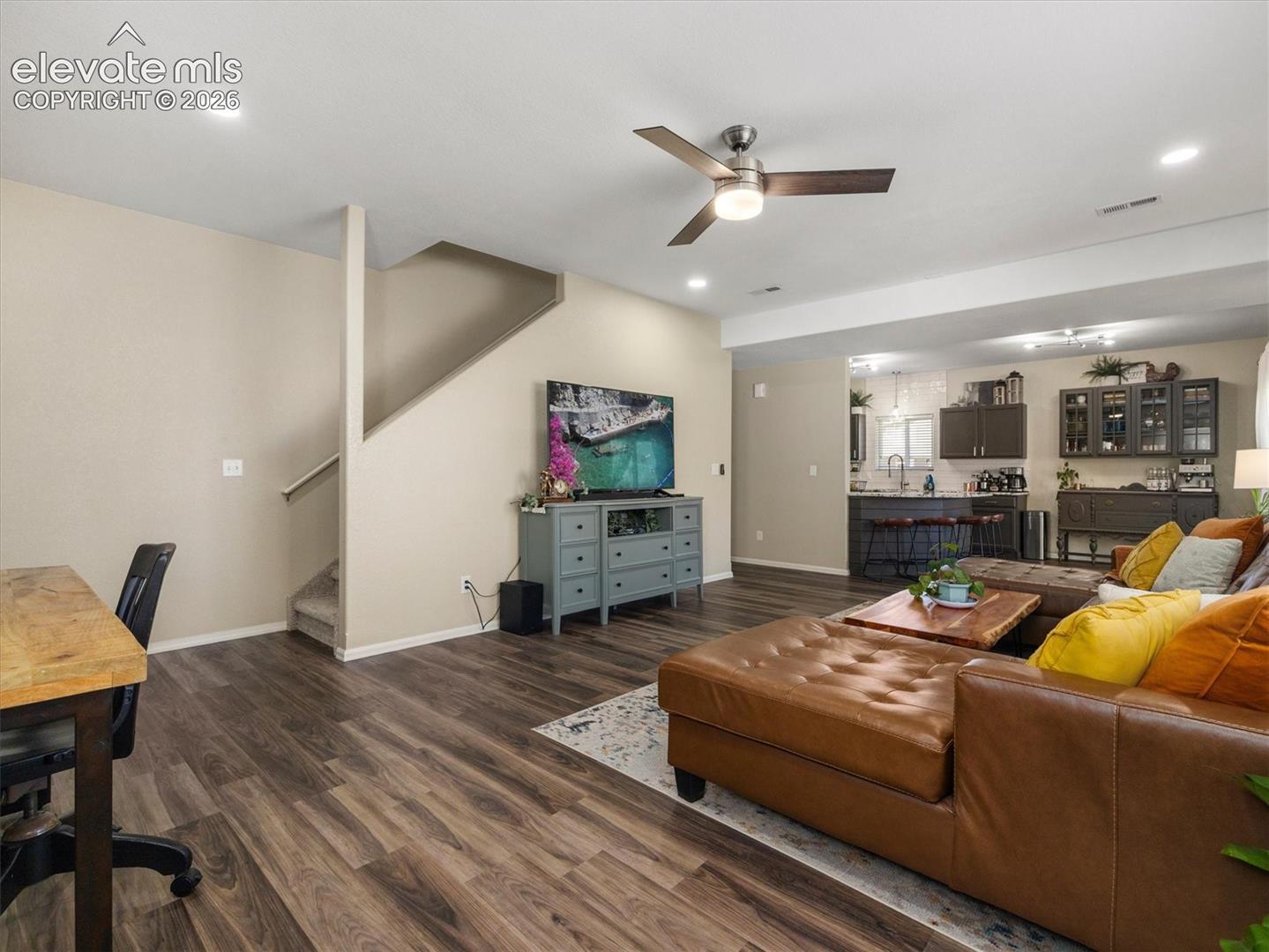 LVP flooring, recessed lighting, and a ceiling fan with integrated light