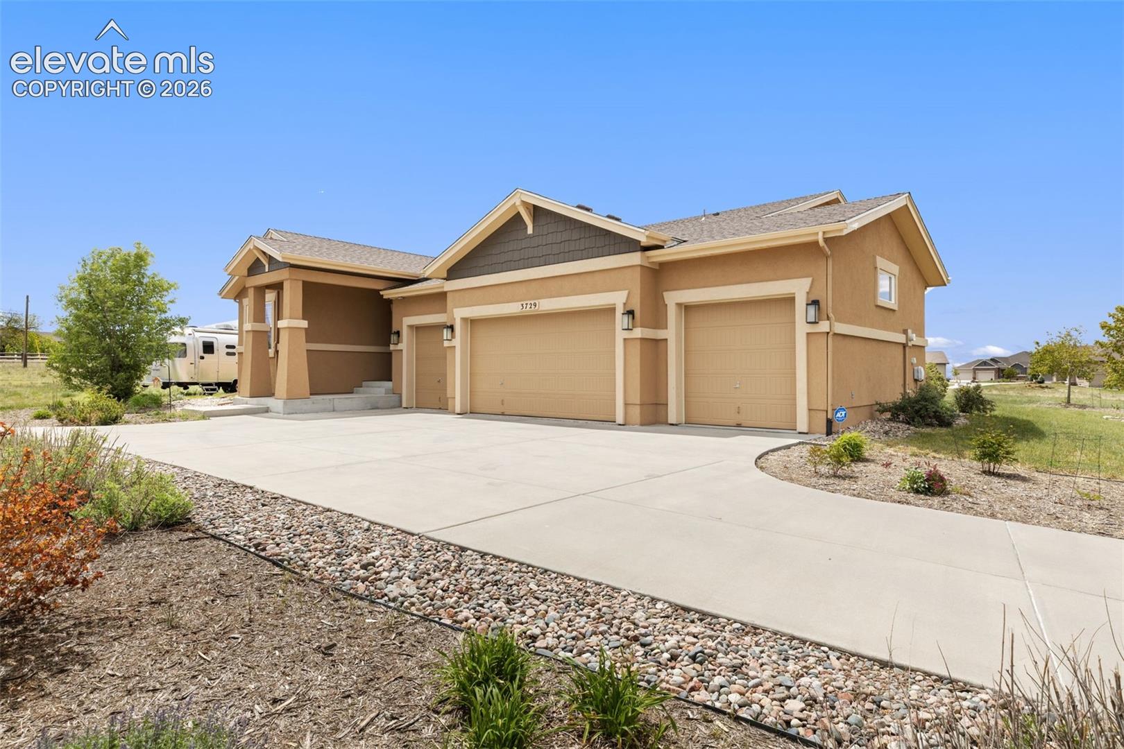 Front of house with 4 car garage