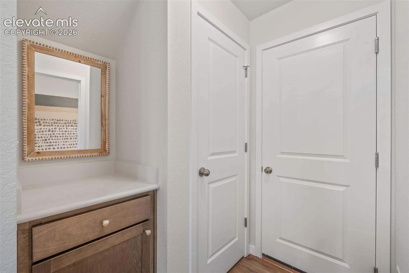 Built-in wood-finish cabinetry with a light-toned countertop
