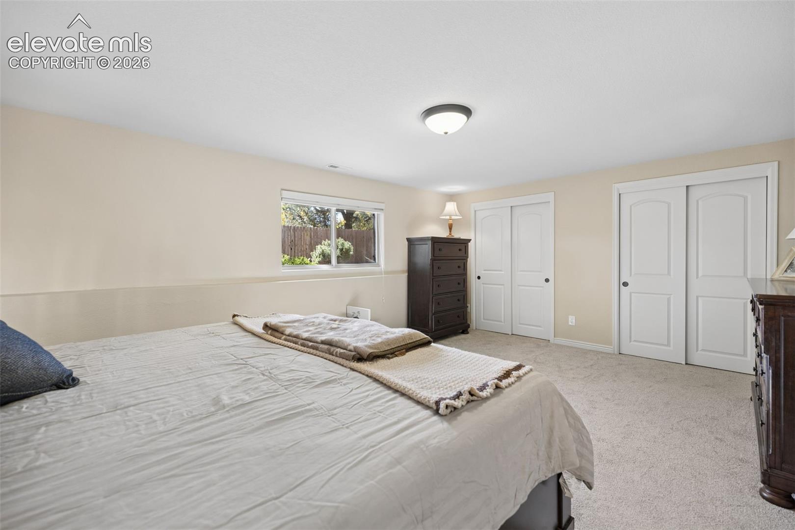 Expansive basement bedroom with plenty of closet space