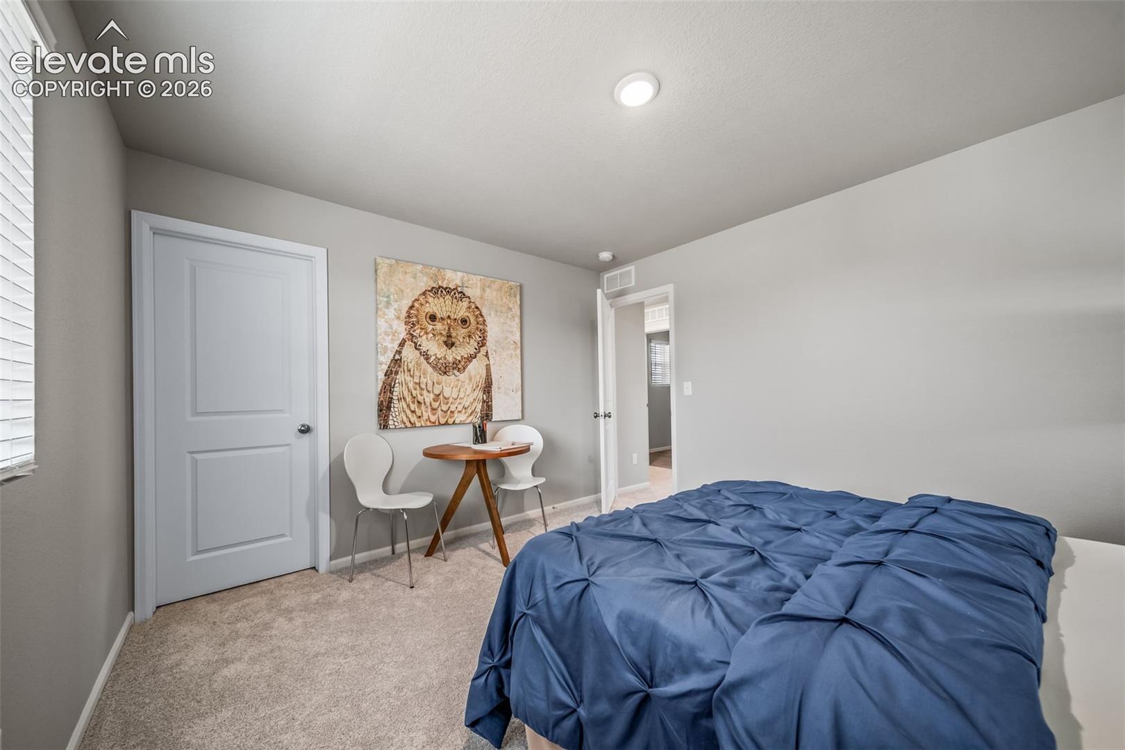 Wall-to-wall carpeting, recessed lighting, and a two-panel interior door
*photos of a model home*