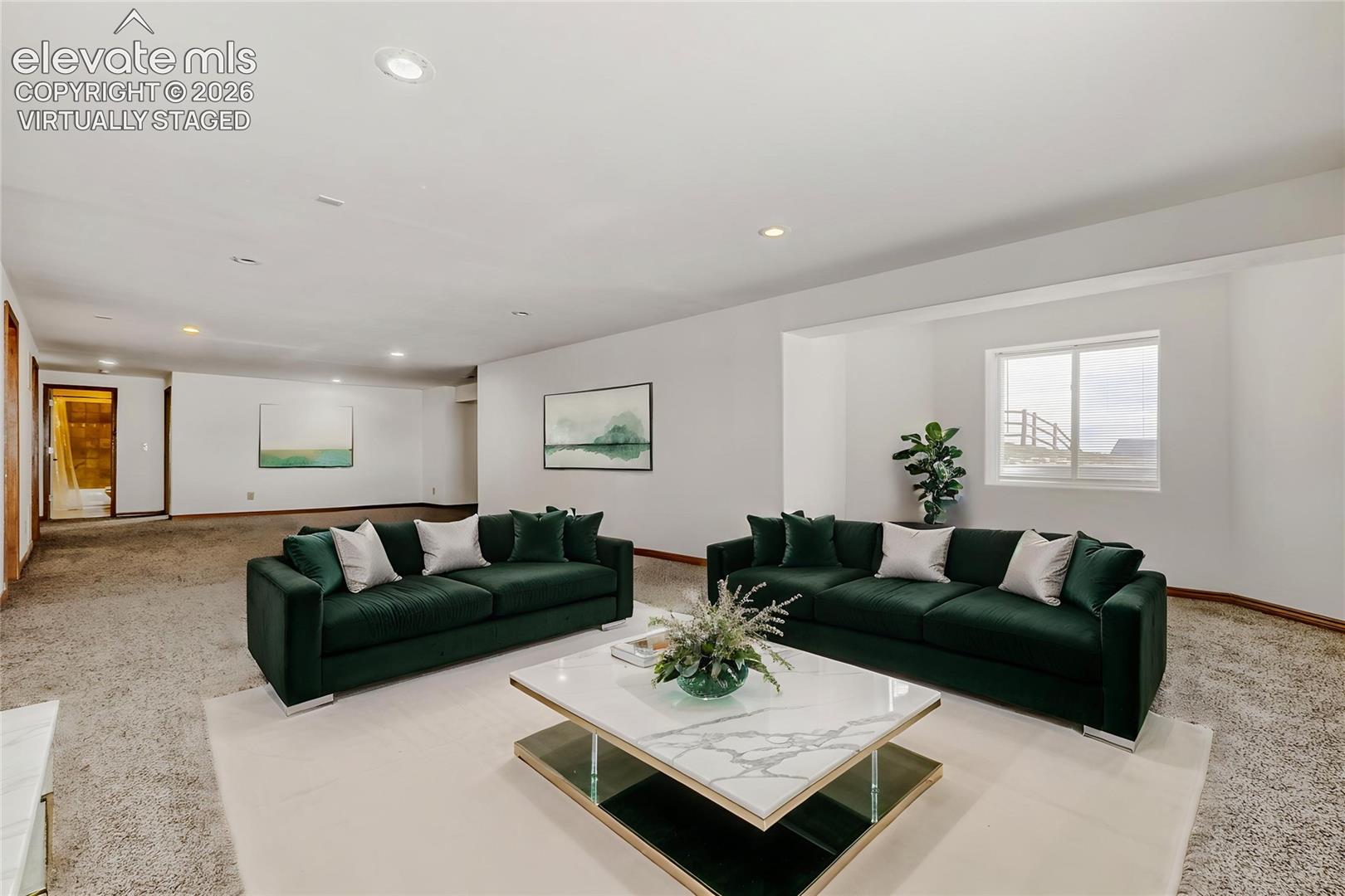 Virtually Staged - Spacious room featuring neutral carpet flooring, recessed lighting, white walls, and a large window