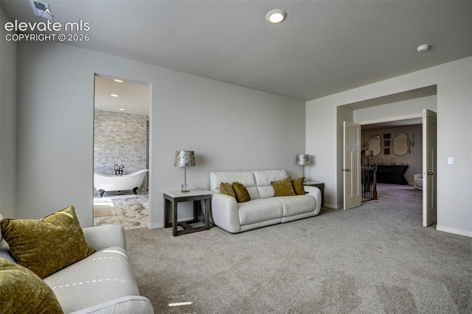 Main bedroom sitting area w gas fireplace