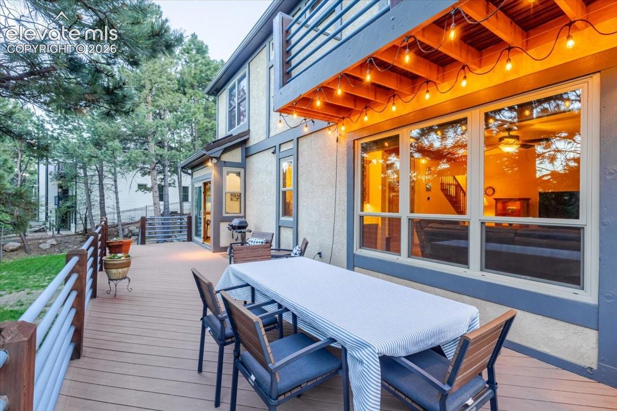 Spacious wood-finish deck with horizontal slat railings