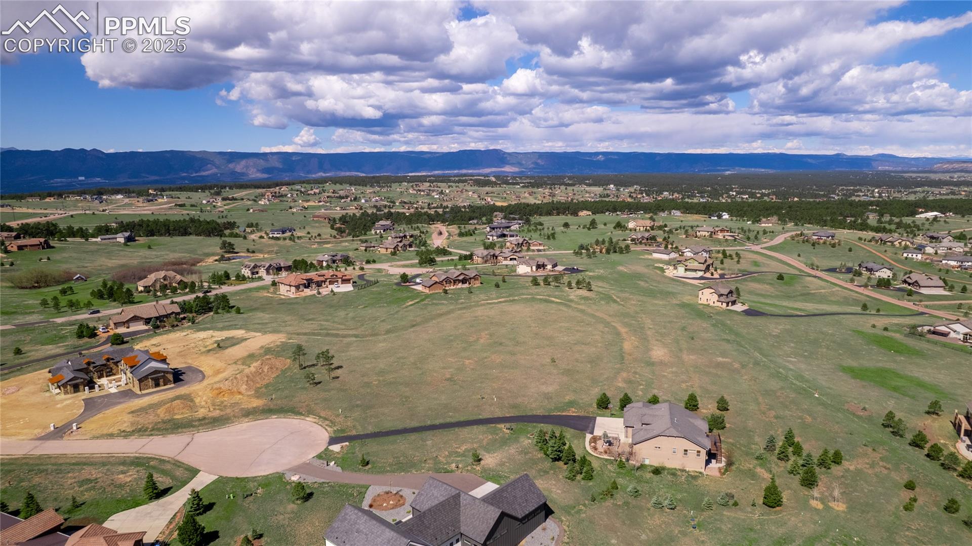 Drone / aerial view featuring a residential view and a mountain view