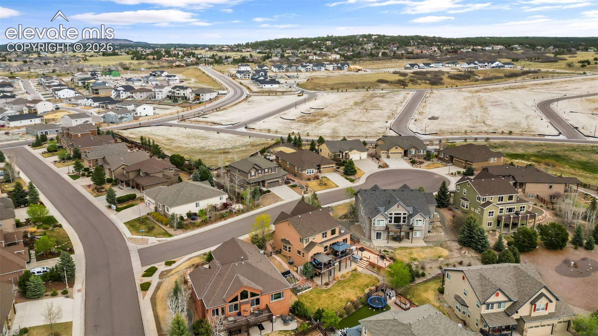 Aerial perspective showcasing residential properties with varied architectural styles