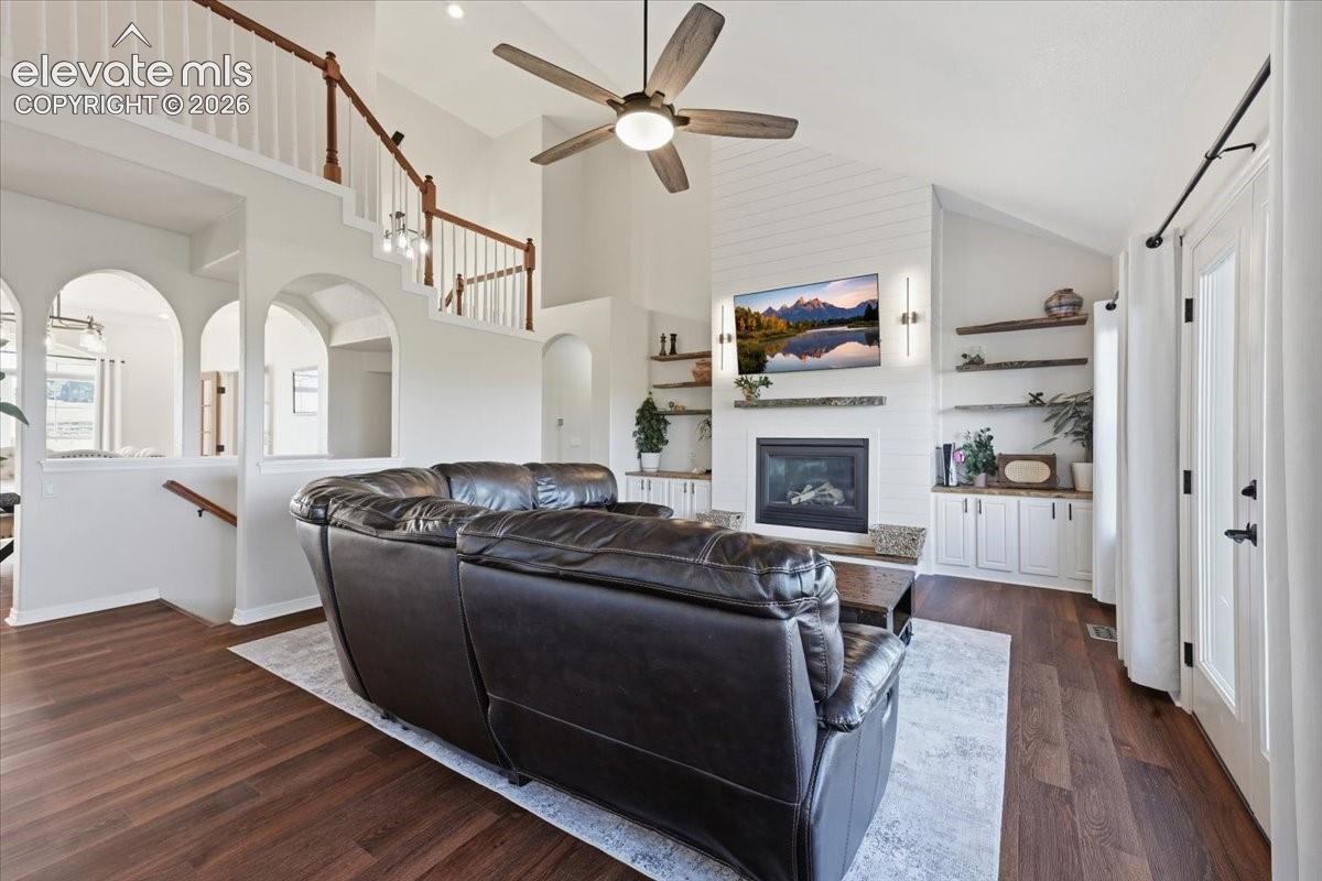 Living room with gas fireplace, built ins and walkout to deck