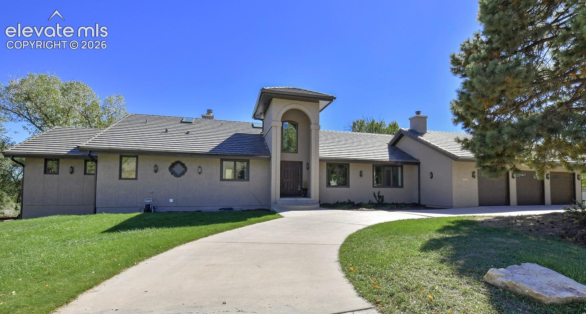 Fantastic ranch-style home with breathtaking views of Cheyenne Mountain, a walkout lower level, and a location just minutes from Broadmoor Valley Park, the Country Club of Colorado, and District 12 schools! The backyard offers an idyllic setting with a stamped concrete patio and a workshop with dedicated electric. Upon entry, you are greeted by vaulted ceilings, plenty of natural light, and a large great room featuring a fireplace, wet bar, and walkout to the back deck. The kitchen is a chef’s dream, featuring a Monogram gas range, Electrolux refrigerator, granite countertops, and a pantry with built-ins. The eat-in kitchen includes a wood-burning fireplace, a dedicated dining area, and a walkout to the covered deck. The main level offers a secondary bedroom with an adjoining bath. The master bedroom features a five-piece bath, a walkout to the back deck, and a large walk-in closet. The lower level includes three generously sized bedrooms with walk-in closets, conveniently located just steps from a bathroom featuring a standalone shower and tile flooring. The family room is complete with a wet bar and a walkout to the backyard. An additional bedroom offers a dedicated walkout, an adjoining three-quarter bath, and a walk-in closet. Reach out today to schedule your private showing and experience one of the best view properties in Colorado Springs!
