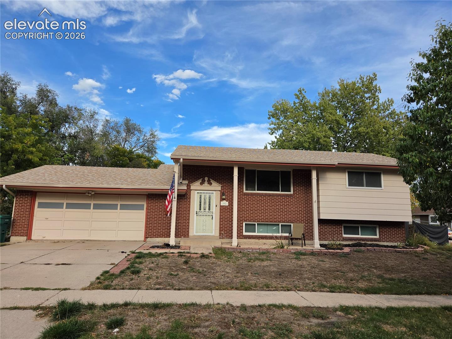 Corner-lot bi-level in an established neighborhood with a convenient location. This four-bedroom, two-bath home offers a practical floor plan with living space on both levels. The main level includes a spacious living room, dining area, kitchen, two bedrooms, and a full bath, with access to the garage and back deck. The lower level provides two additional bedrooms, a second living area, laundry, and another full bath. One of the lower-level bedrooms could also work well as a home office, hobby room, or flex space. The bathrooms have seen some updates, including vanities, lighting, tile work, and paint. Outside, the backyard provides plenty of room for outdoor activities, gardening, or simply enjoying some fresh air. Conveniently located near Palmer Park, schools, neighborhood parks, Academy Boulevard shopping, and Powers Boulevard. A functional home with plenty of space and a location that makes getting around town easy.