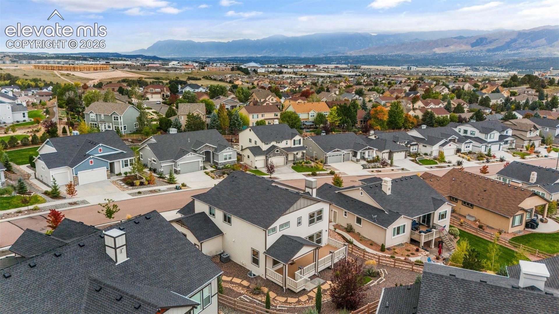 Residential neighborhood featuring a consistent architectural style, paved streets, and mature landscaping