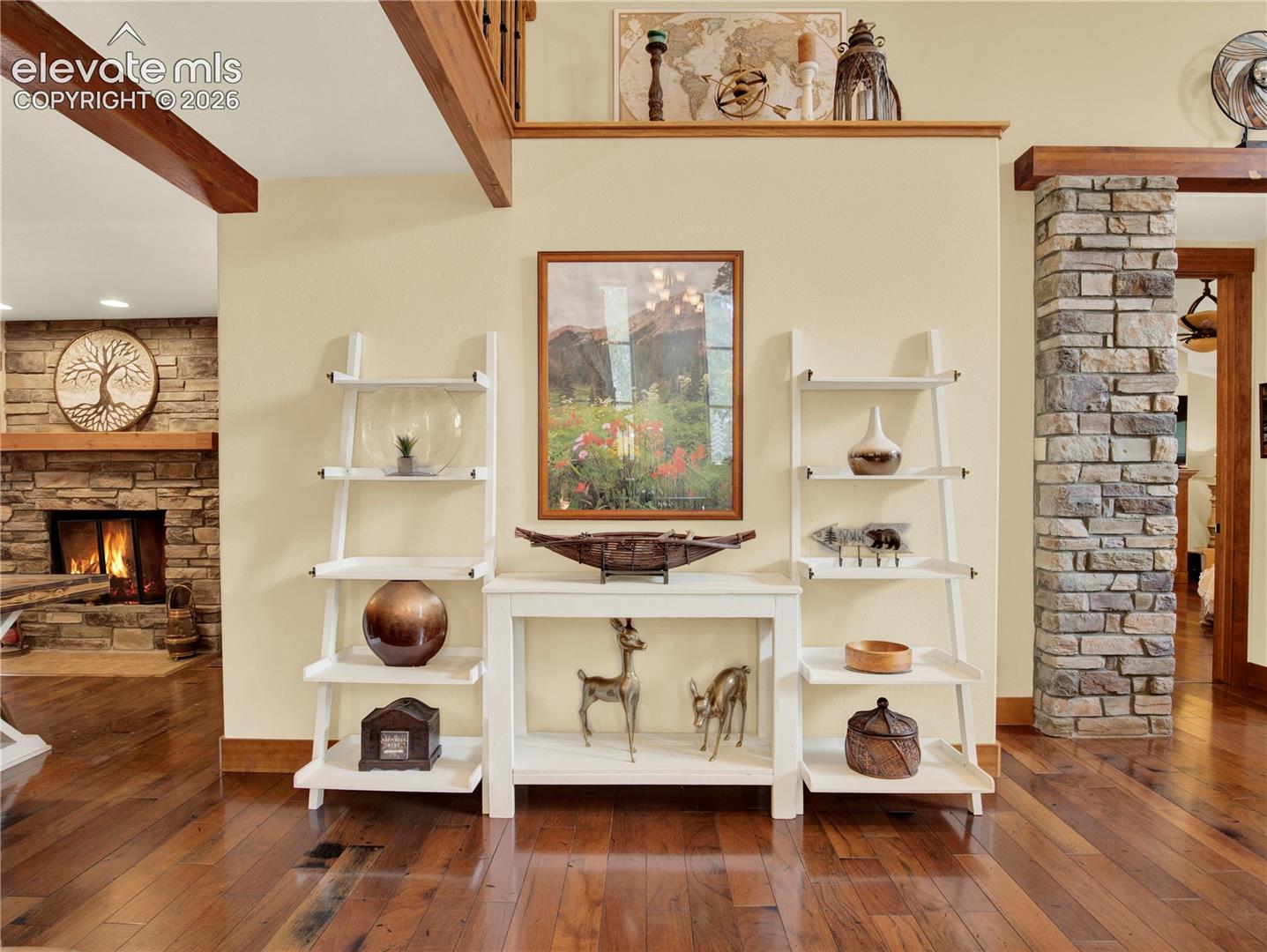 Wall to the end of the living room that separates the formal dining room and primary bedroom