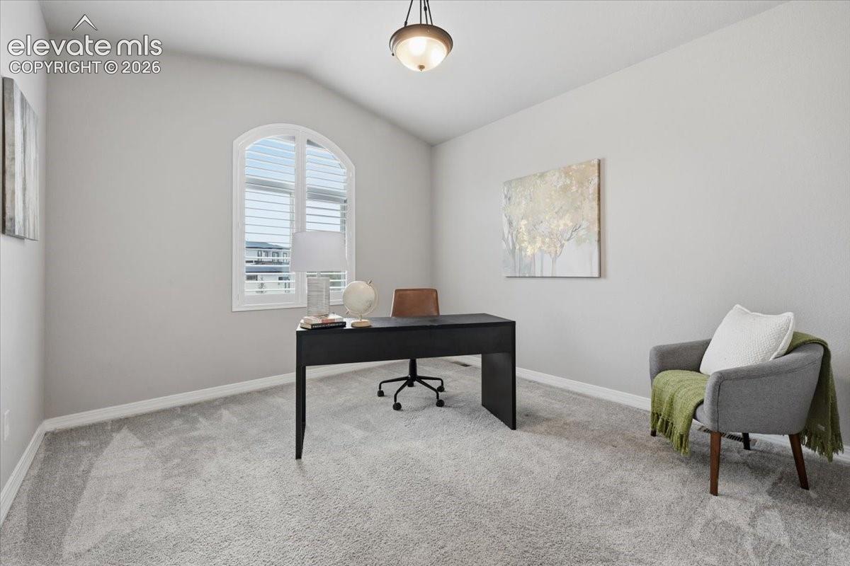 Main level bedroom being used as an office has views!