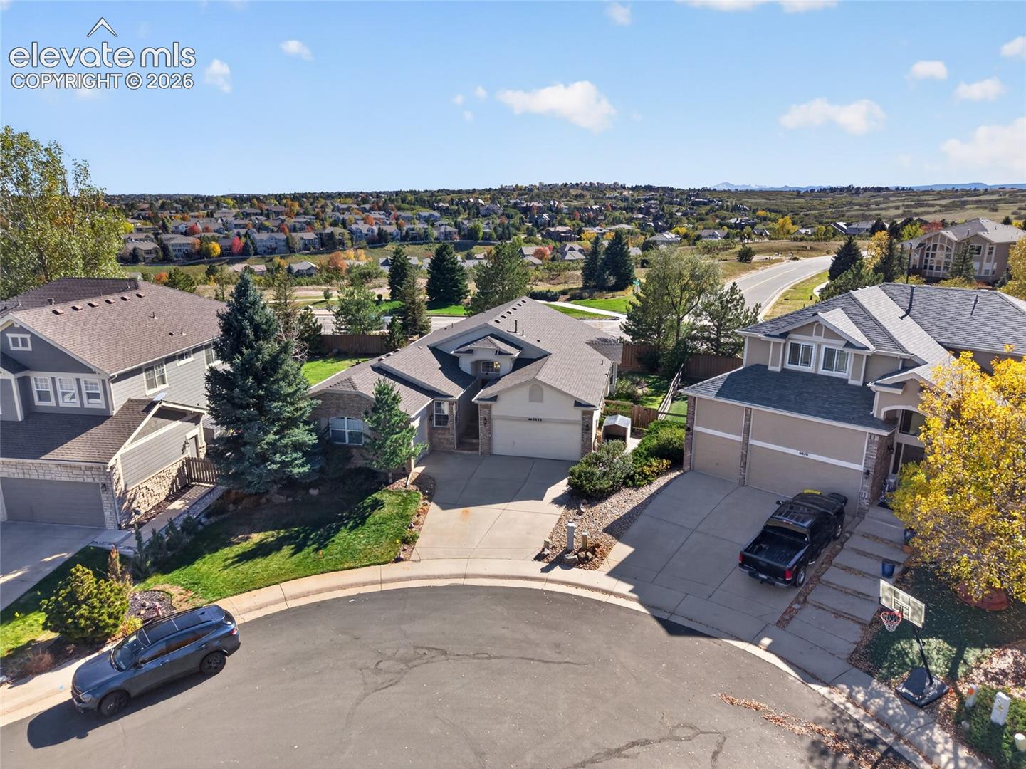 Cul-de-sac location featuring multi-level rooflines, composite shingle roofing, attached multi-car garages, and concrete driveways