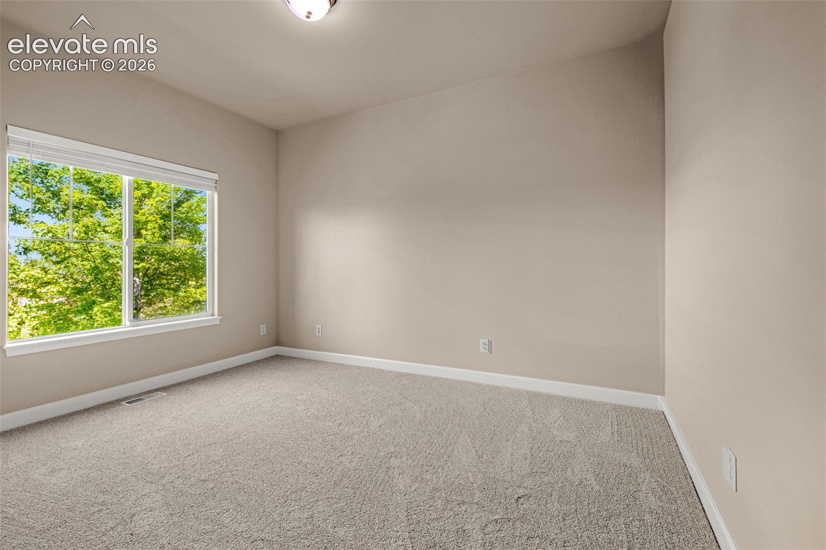 Behind the Fireplace is a private Office with views of the mountains and mature trees.  Overlooks the fenced backyard so you can keep an eye on the littles.  