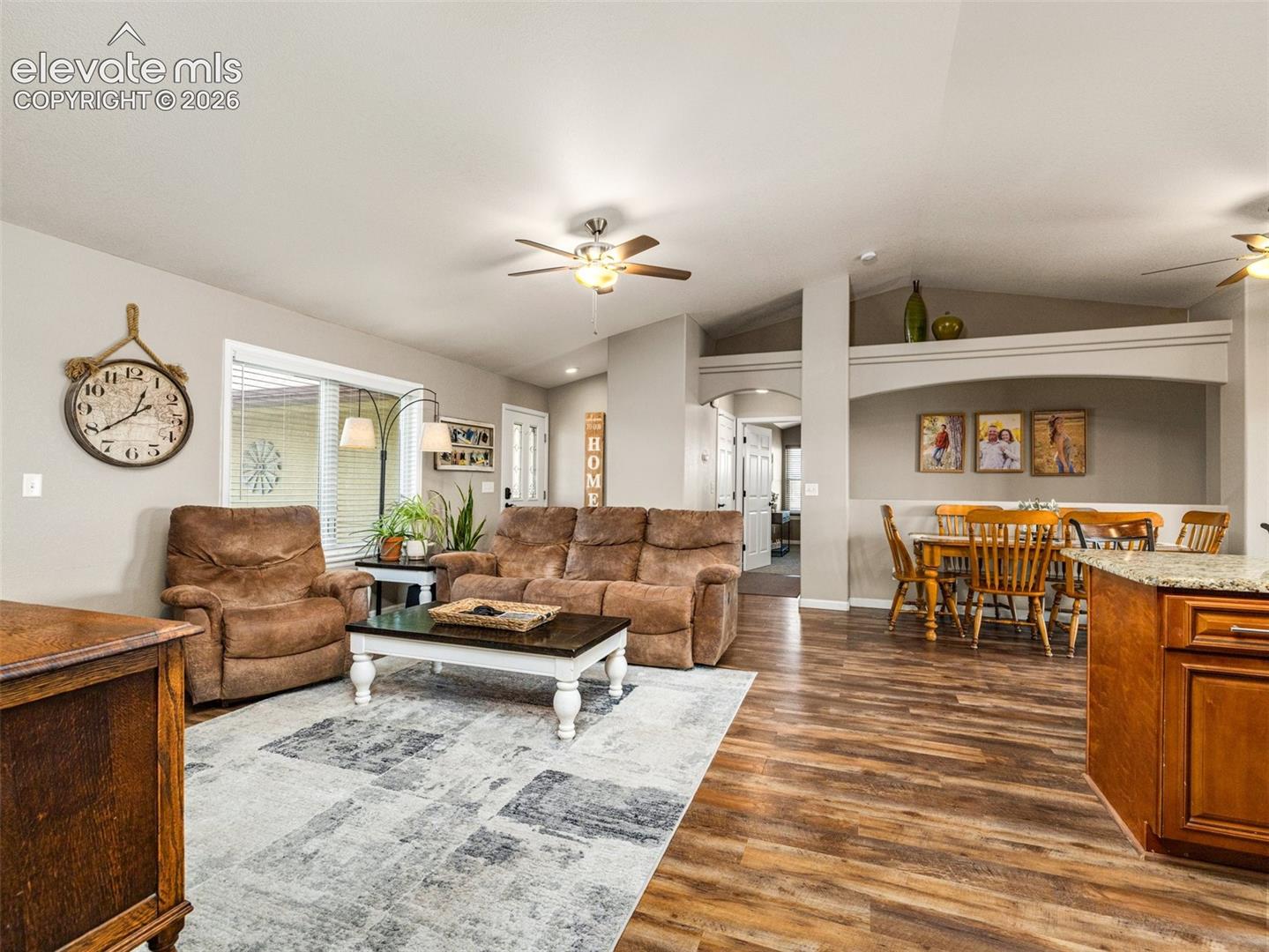 Full view of living room, entrance, dining area