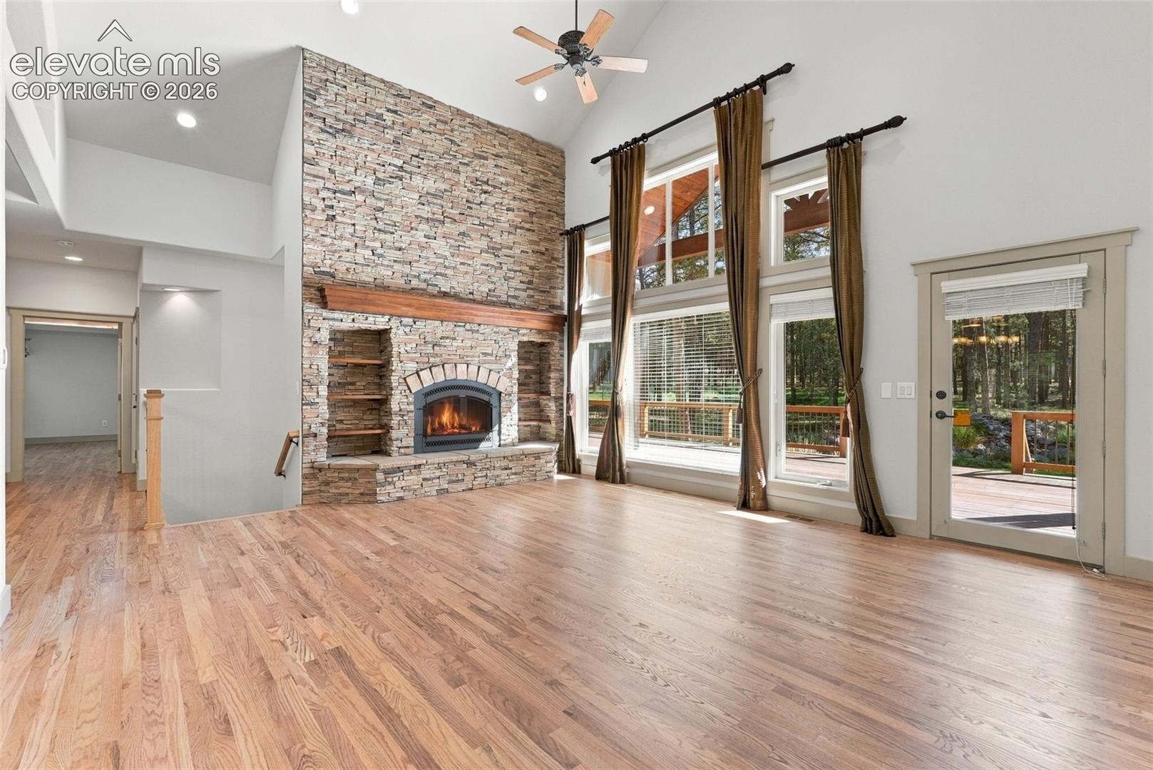 Floor to ceiling stone hearth fireplace