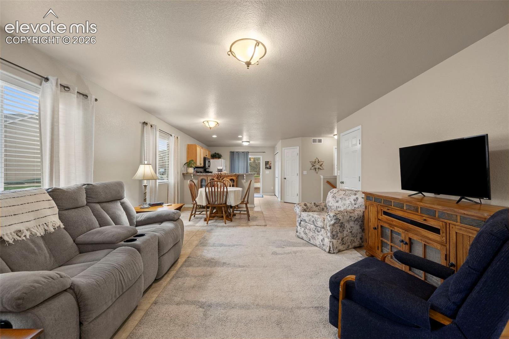 Open-concept living area into kitchen