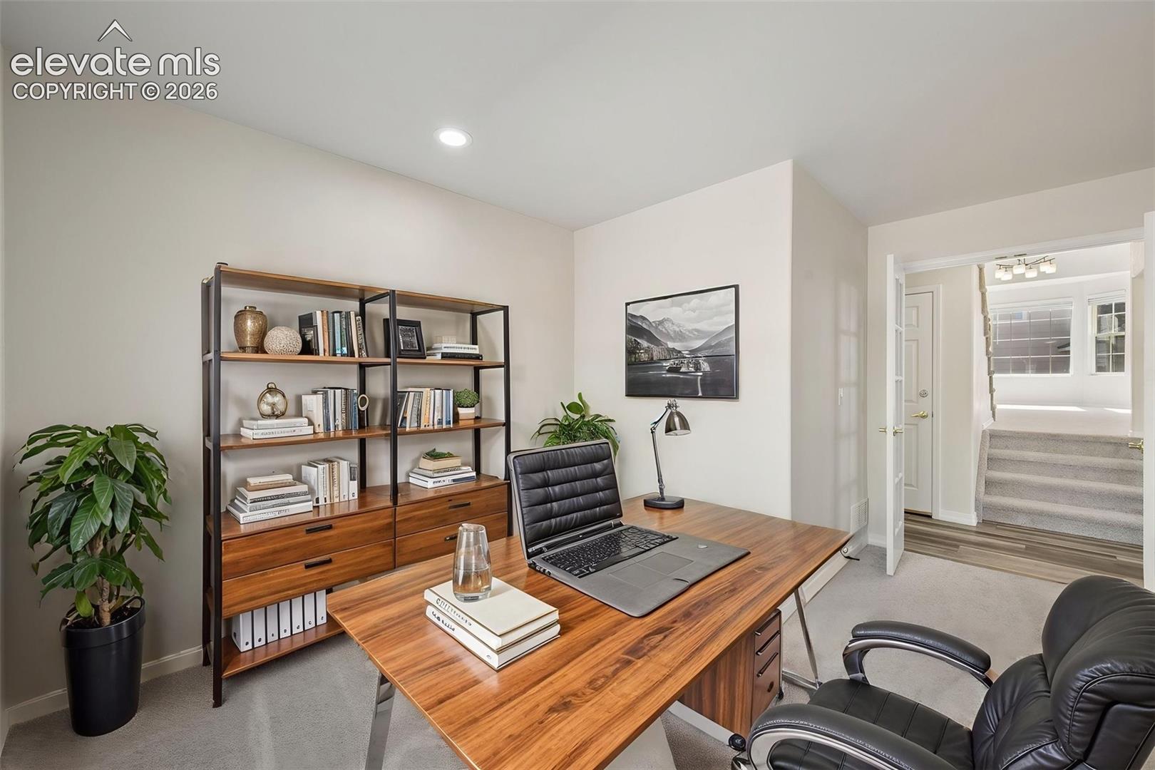 Room with recessed lighting, neutral wall paint, and carpeting