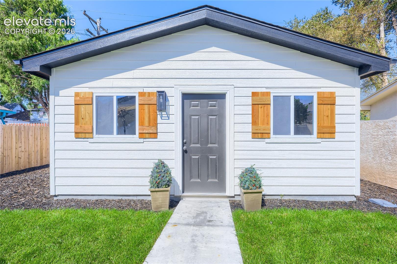 The oversized, 2-car garage, with shutters that match the shutters on the front of the home.