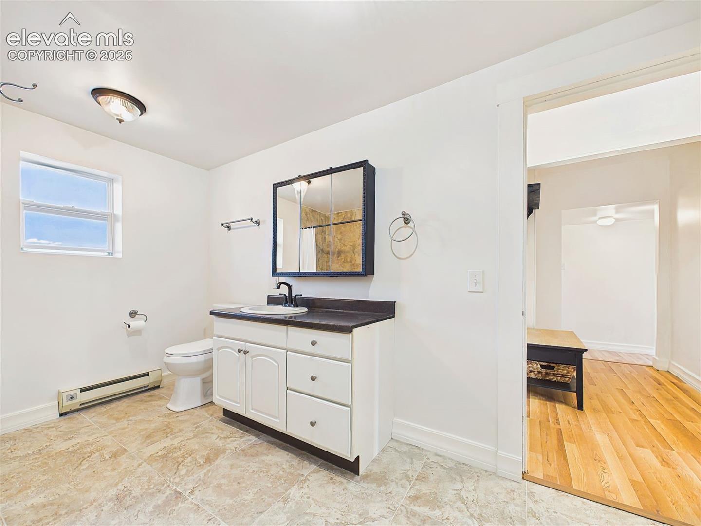 Bathroom – Spacious  bathroom includes a large vanity with generous counter space, updated finishes, and direct access from the primary suite.