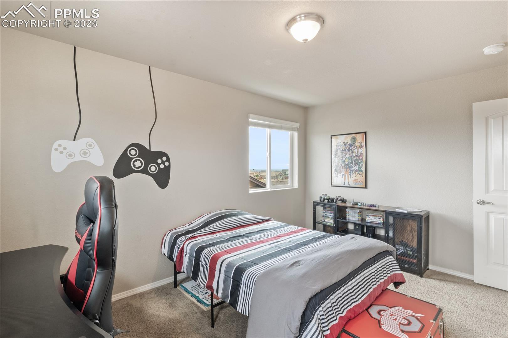 Bedroom featuring carpet and an office area