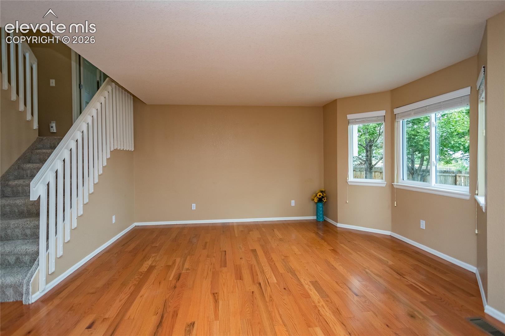 Living room with stairs to the other levels of the home