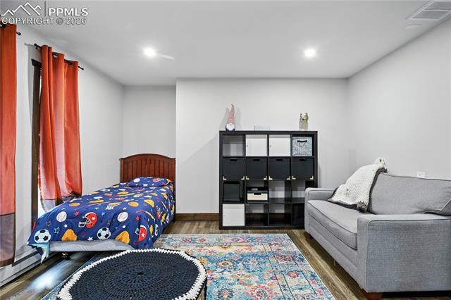 Bedroom featuring wood finished floors and recessed lighting