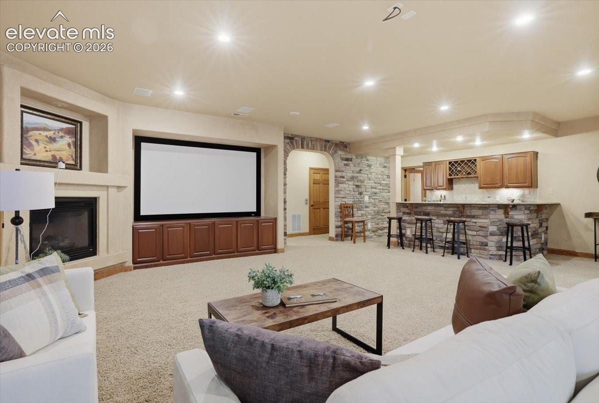 Family Room doubles as the Home Theater Room with speakers and screen ready to go! Gas Fireplace!