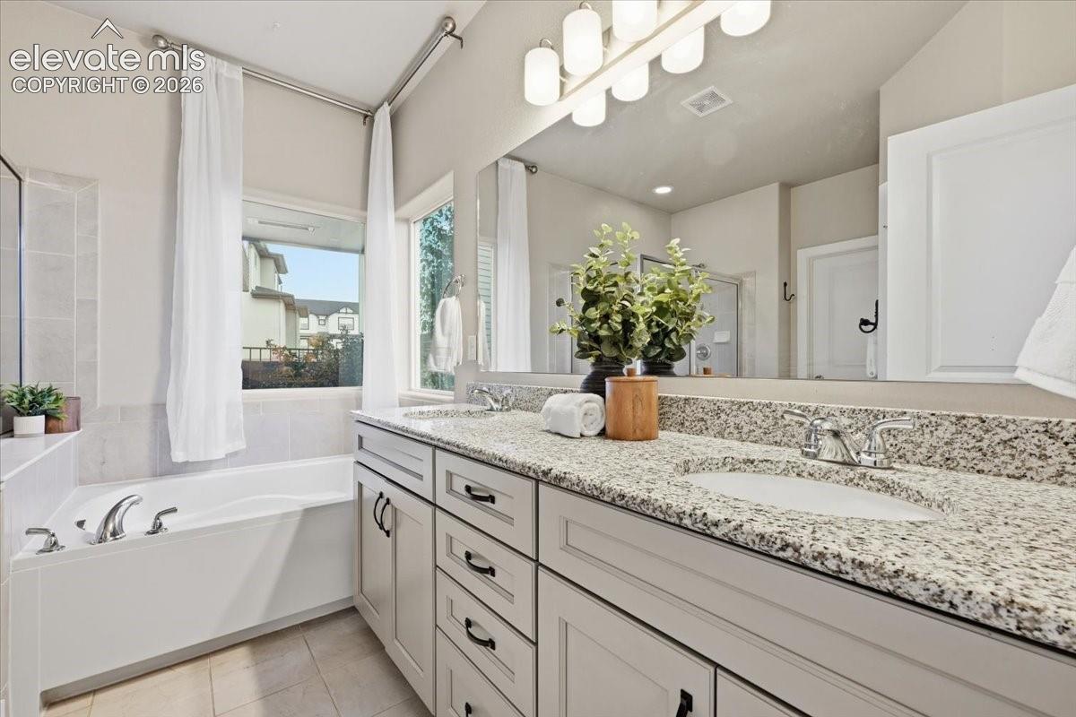 Dual vanity with granite countertop and undermount sinks