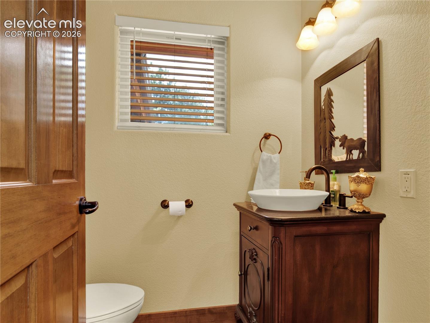 A 1/2 bathroom located at the front entrance