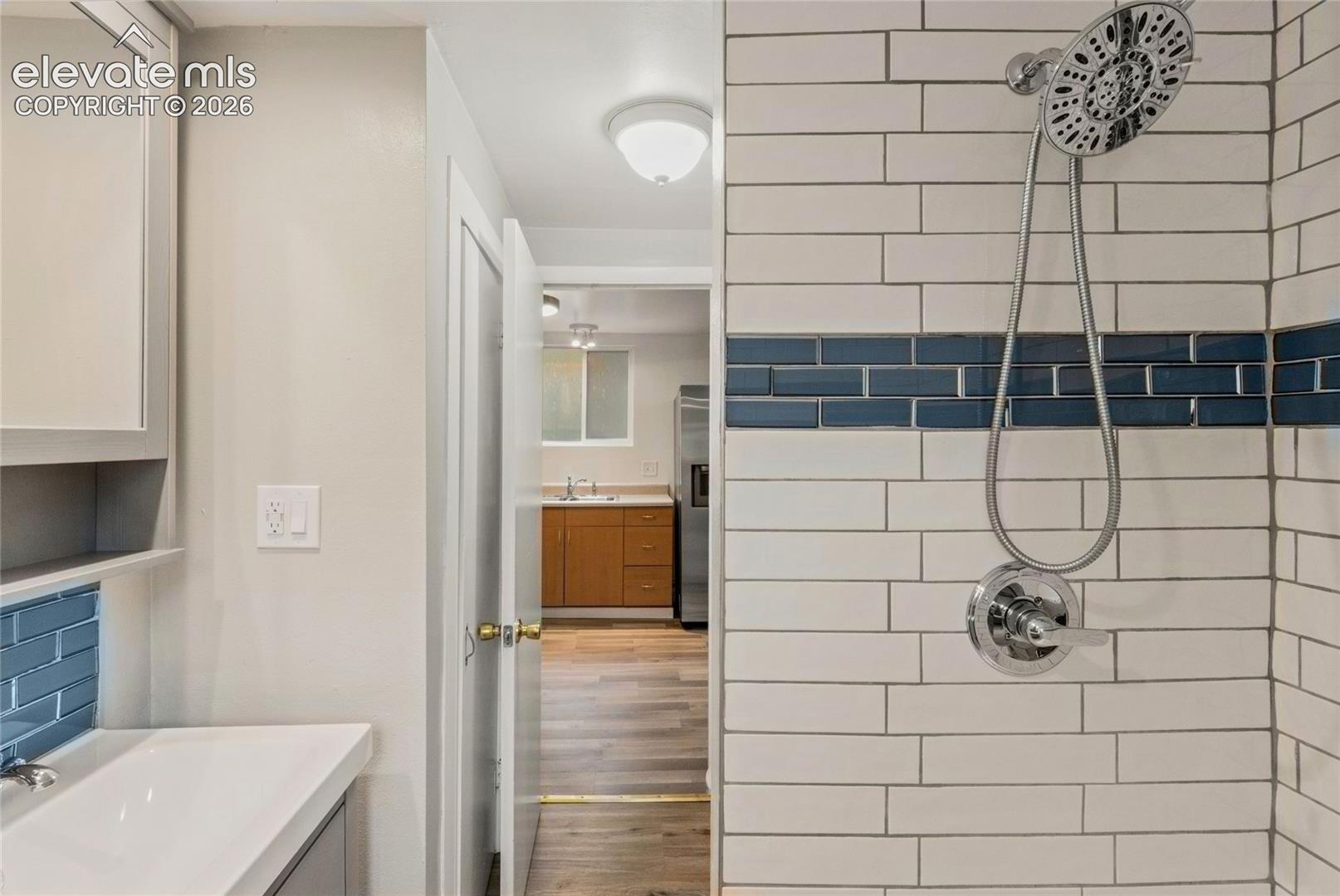 Bathroom with stand-up shower and subway tile