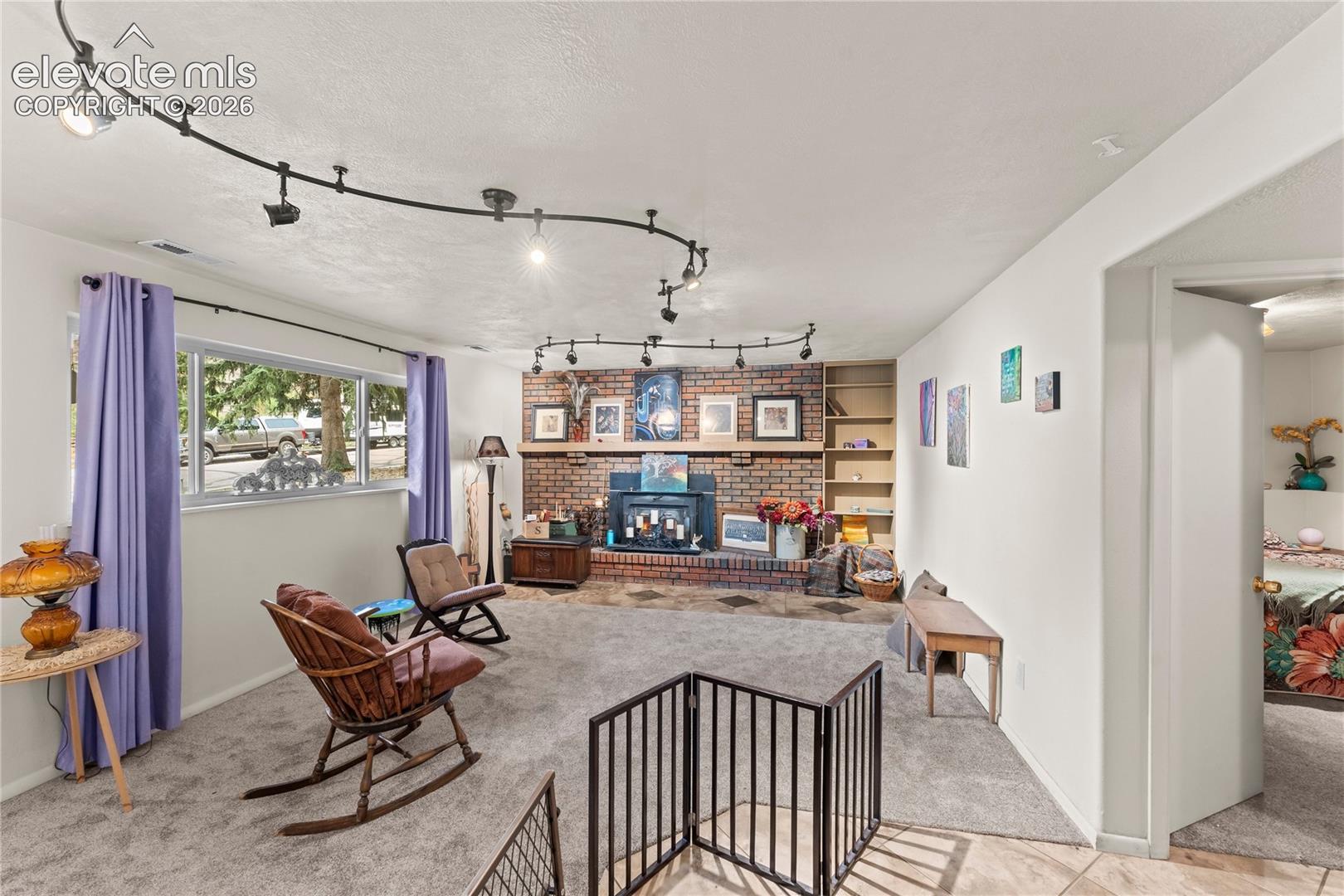 Garden level windows, wood burning fireplace, upgraded lighting