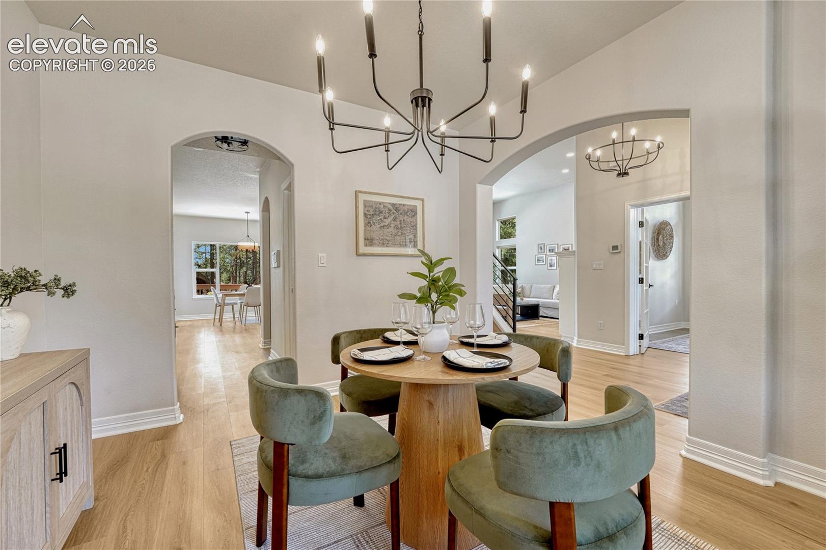 Note the arched entries and access to both the kitchen and the great room. 