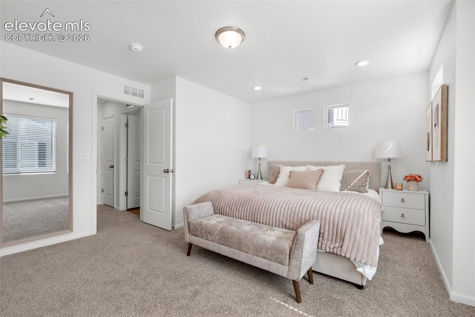 Plush carpet flooring, recessed lighting, and a neutral color palette
*photos of a model home*