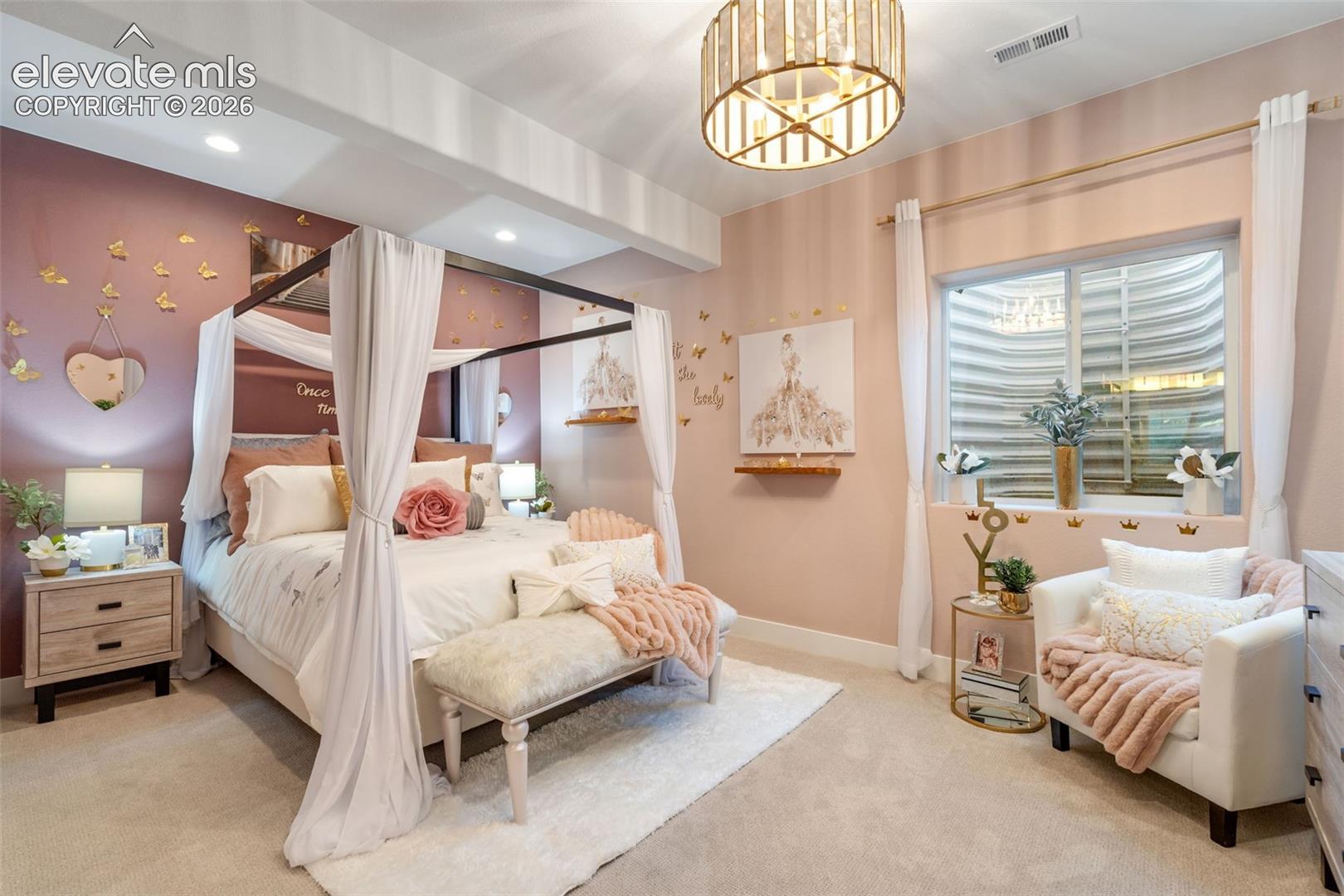 Drum-style metal chandelier, accent walls with two-tone paint, wall-mounted floating wood shelving, and an egress window with a tiered retaining wall well