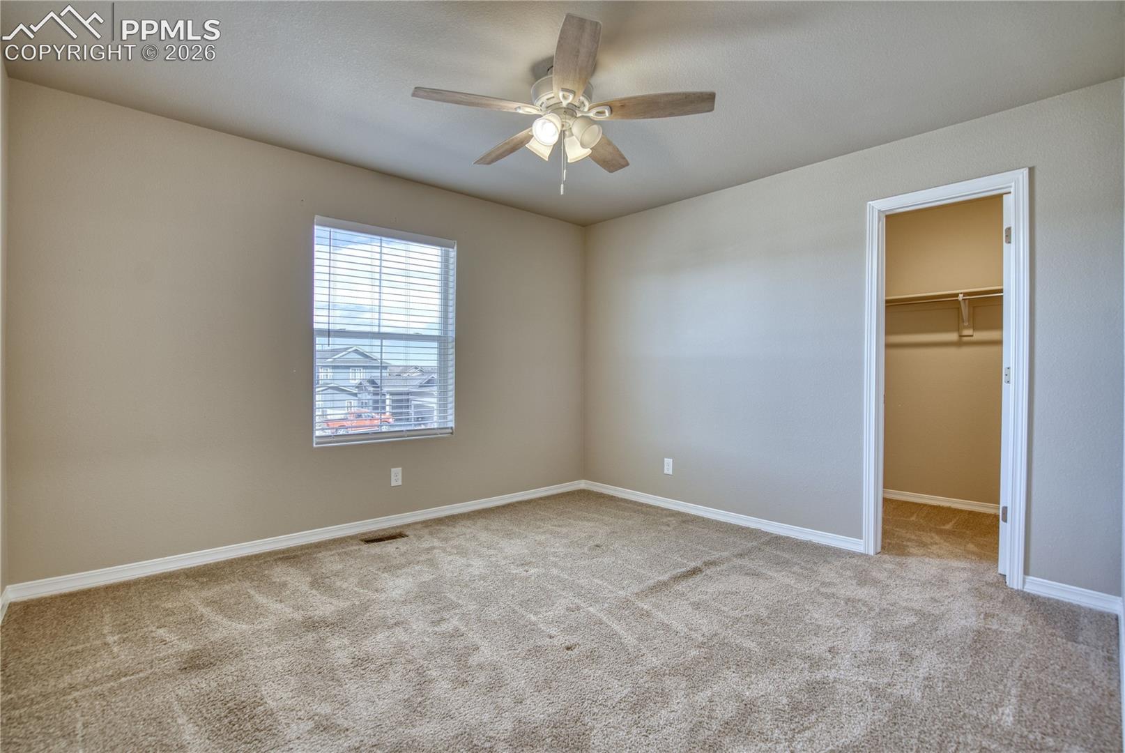 Bedroom with walk-in closet