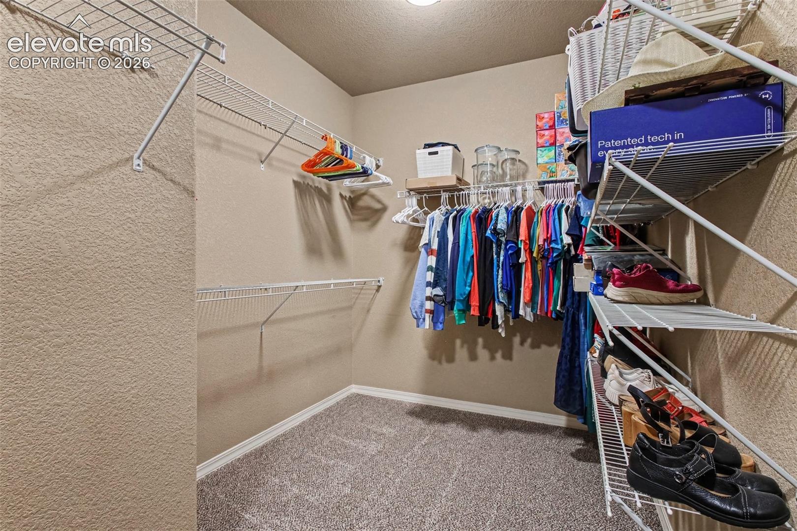 Primary Bedroom Walk-in Closet. More closet space to the left not visible in photo.