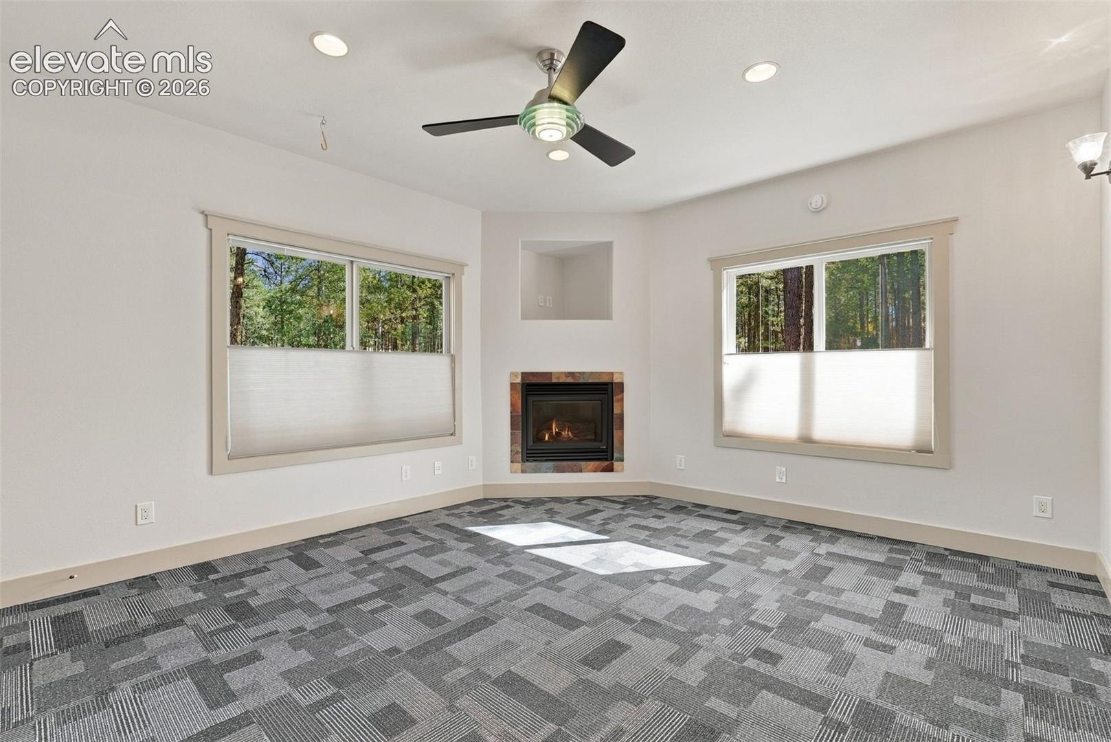 Private home gym fitness room with fireplace