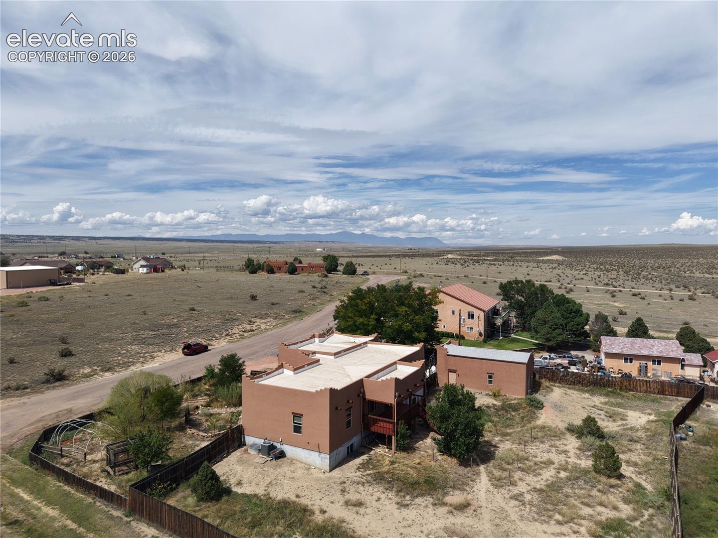 View of the home and land facing NW towards the mountains.  Home is peaceful and full of life with the natural surroundings.  This Pueblo West home is about 7 minutes off the interstate.
